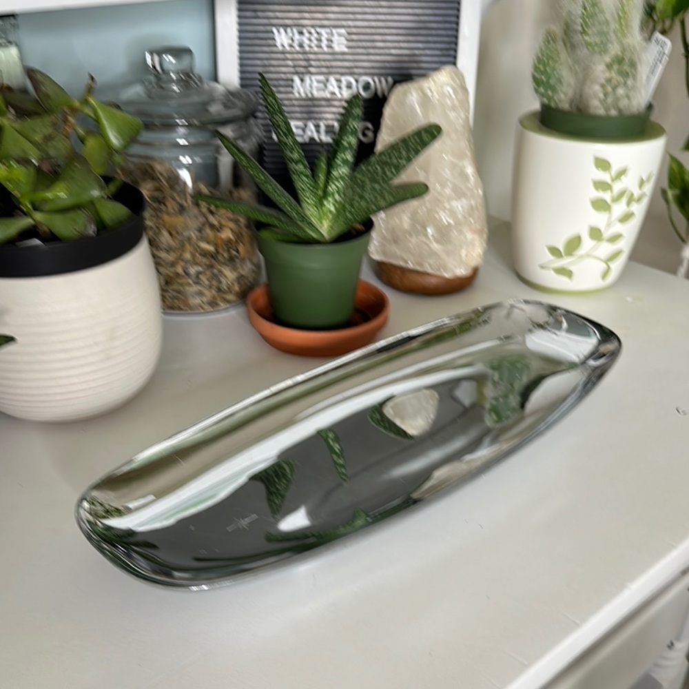 Chrome and round footed MCM serving tray
reflective, polished surface-starburst